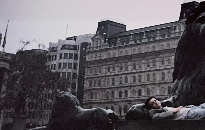 Safe between the paws of the lion. Trafalgar Square circa 1996.